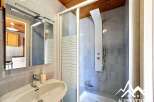 This bathroom features a modern design with a sleek shower and a stylish sink.