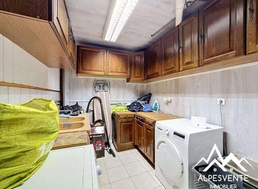 Discover this charming property featuring a well-equipped laundry room, perfect for everyday convenience.