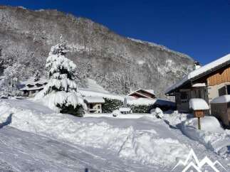 Experience the charm of a winter wonderland with this picturesque property nestled in a snowy landscape.
