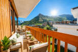 Experience breathtaking mountain views from this stunning balcony, perfect for enjoying your morning coffee or evening cocktails.
