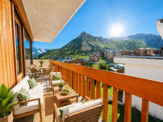 Experience breathtaking mountain views from this stunning balcony, perfect for enjoying your morning coffee or evening cocktails.