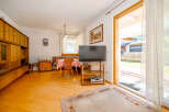 Step into this inviting living space, featuring a warm and welcoming ambiance.