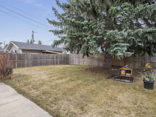 Discover the tranquility of this backyard oasis, perfect for relaxation and outdoor gatherings.