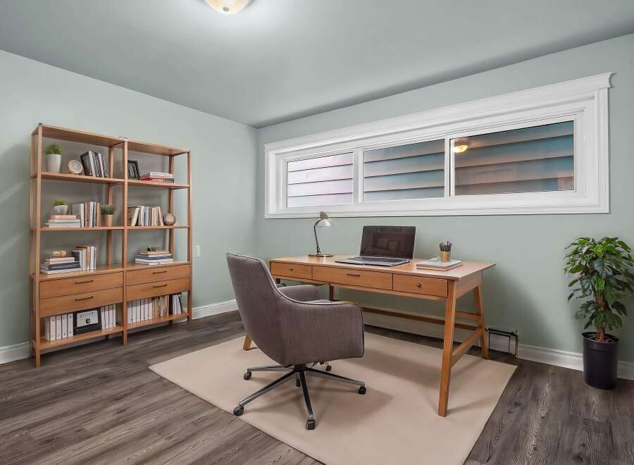 This stylish home office features a modern desk, perfect for remote work or creative projects.