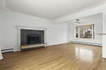 This stunning living room boasts a cozy fireplace, perfect for those chilly evenings.