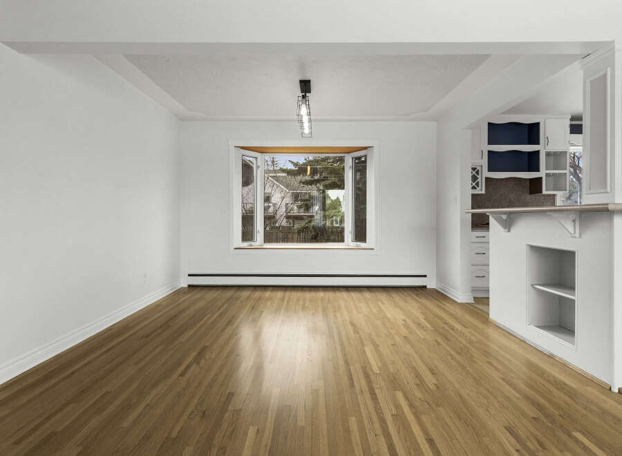 Step into this inviting space, featuring stunning hardwood floors that flow throughout.