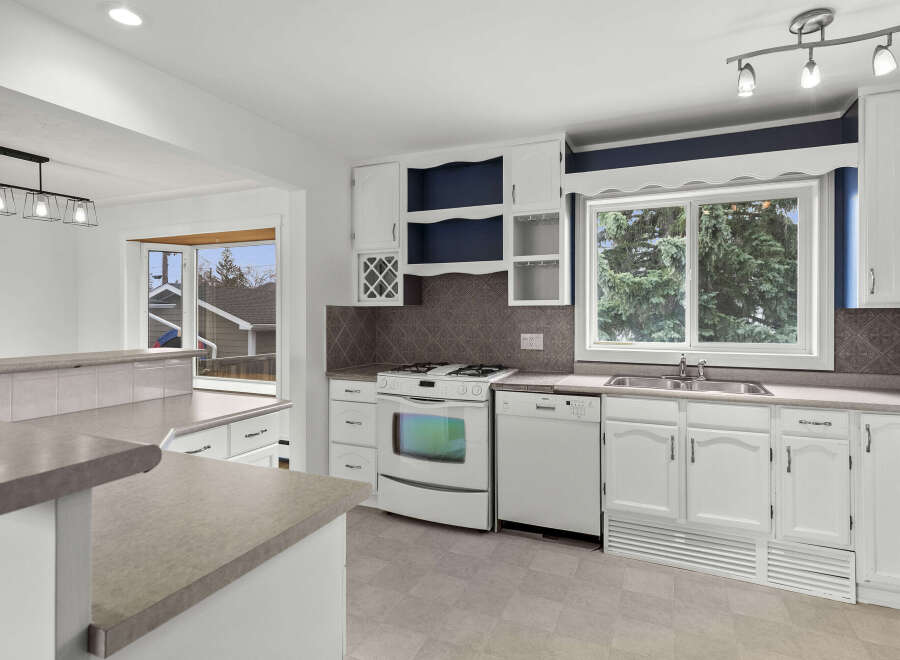 Step into this bright and inviting kitchen, perfect for culinary adventures and family gatherings.