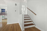 Step into this inviting home and discover a beautifully designed staircase leading to the upper levels.