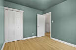 Step into this inviting room featuring a fresh coat of paint and beautiful hardwood floors.