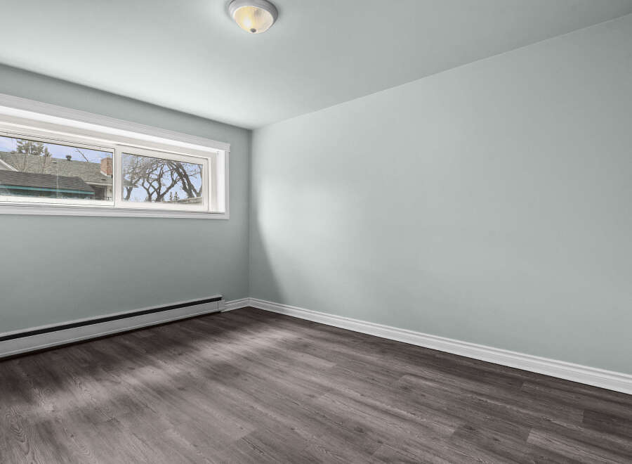 This inviting room features a neutral color palette, creating a versatile space ready for your personal touch.