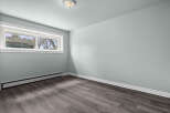 This inviting room features a neutral color palette, creating a versatile space ready for your personal touch.