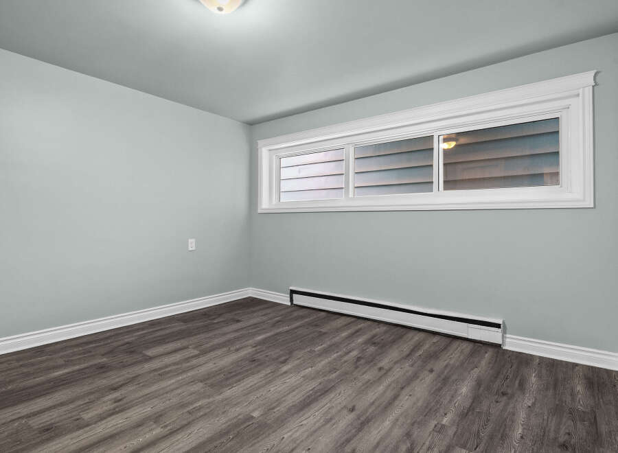 This inviting room features a neutral color palette, creating a versatile space ready for your personal touch.
