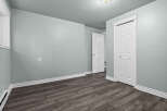 This inviting room features a neutral color palette, creating a serene and versatile space.