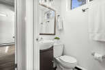 Step into this beautifully designed bathroom, featuring a modern sink and a sleek toilet.