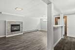 This inviting living space features a cozy fireplace, perfect for those chilly evenings.