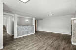 Discover the potential of this spacious property! Featuring a modern design with a stylish accent wall and sleek flooring, this space is ready for your personal touch.