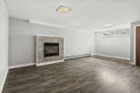 This inviting living space features a cozy fireplace, perfect for creating a warm and welcoming atmosphere.