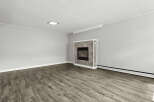 This inviting living space features a cozy fireplace, perfect for creating a warm and welcoming atmosphere.