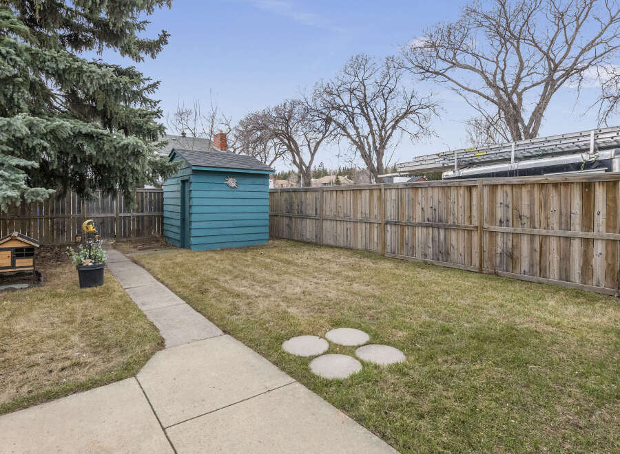 This charming property boasts a spacious backyard, perfect for outdoor activities and relaxation.