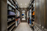 Step into luxury with this stunning walk-in closet, designed to maximize space and style.