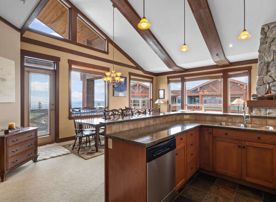 This stunning kitchen boasts a seamless blend of rustic charm and modern elegance.