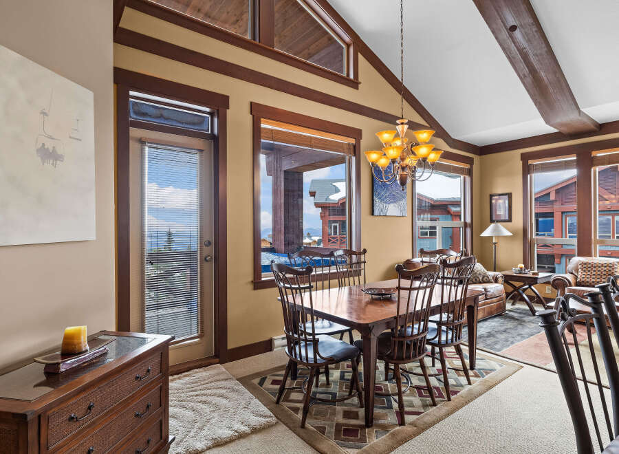 This stunning dining area offers a warm and inviting atmosphere, perfect for entertaining or enjoying a quiet meal.