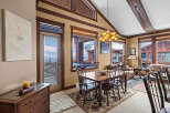 This stunning dining area offers a warm and inviting atmosphere, perfect for entertaining or enjoying a quiet meal.