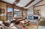 Experience luxury living in this stunning property featuring a cozy fireplace and expansive windows offering breathtaking views.