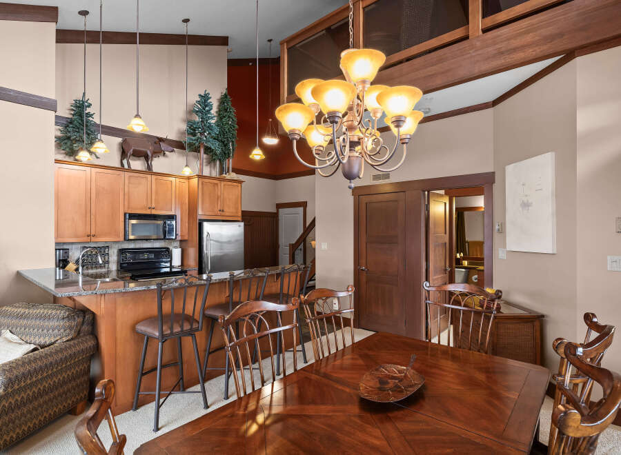 This stunning property boasts a beautifully designed kitchen with modern appliances and a breakfast bar, perfect for casual dining.