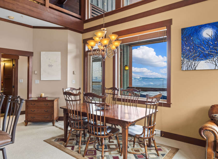 This stunning dining room boasts a warm and inviting atmosphere, perfect for entertaining guests or enjoying family meals.