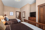 This inviting bedroom features two comfortable beds, perfect for guests or a relaxing retreat.