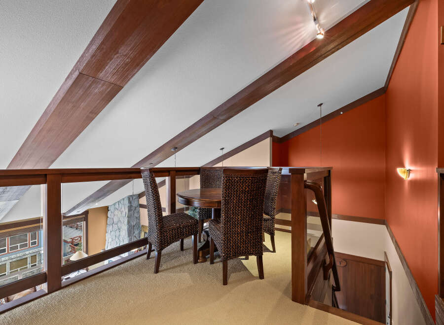 This stunning property boasts a unique loft area, perfect for a dining or relaxation space.