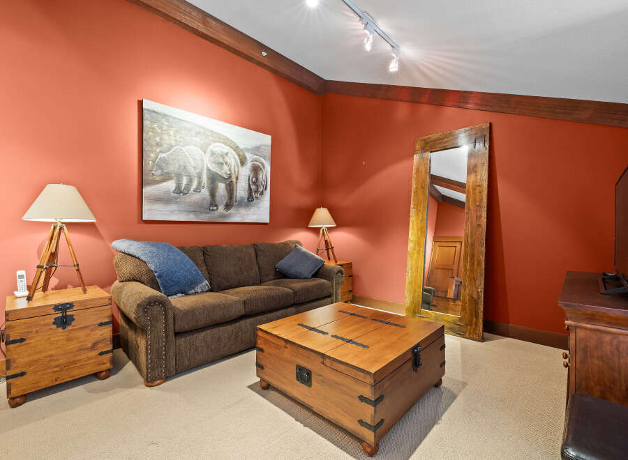 This cozy living room features a comfortable brown sofa, perfect for relaxing after a long day.