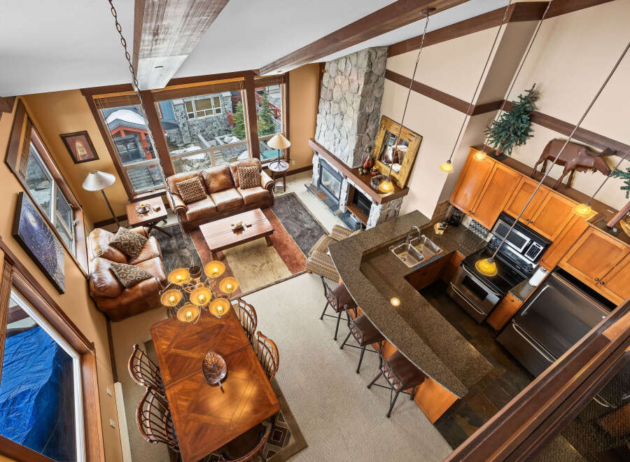 Experience luxury living in this stunning property featuring a cozy living room with a fireplace and comfortable seating.