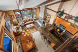 Experience luxury living in this stunning property featuring a cozy living room with a fireplace and comfortable seating.