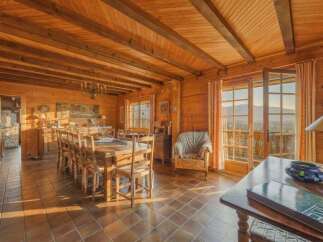 Step into a world of rustic elegance with this stunning property, showcasing a warm and inviting interior.