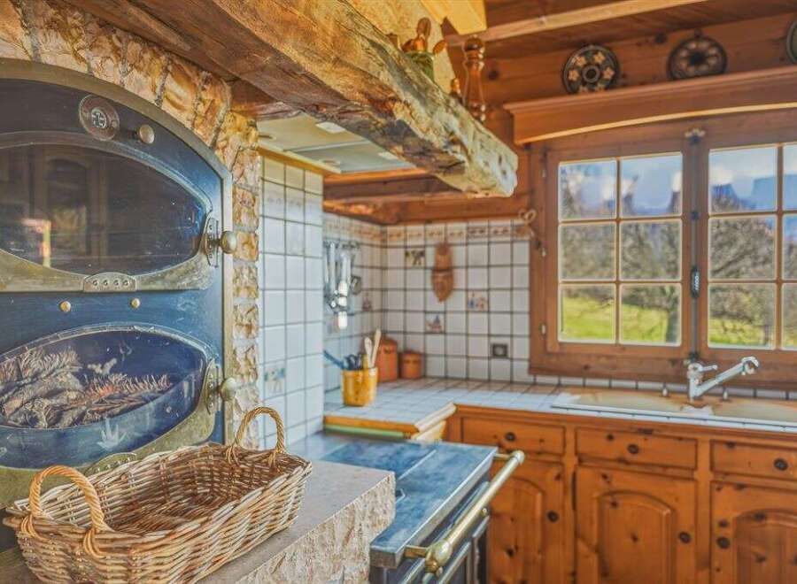 Step into the charm of this rustic kitchen, a perfect blend of traditional design and modern comfort.