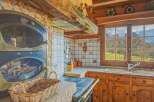 Step into the charm of this rustic kitchen, a perfect blend of traditional design and modern comfort.