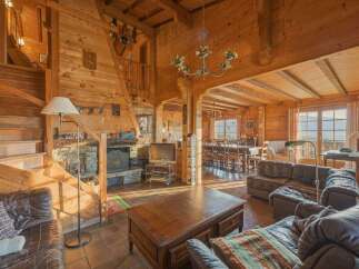 Step into a cozy and inviting log cabin retreat, perfect for a relaxing getaway.