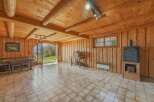 Step into a rustic haven with this charming property, featuring a warm and inviting interior.