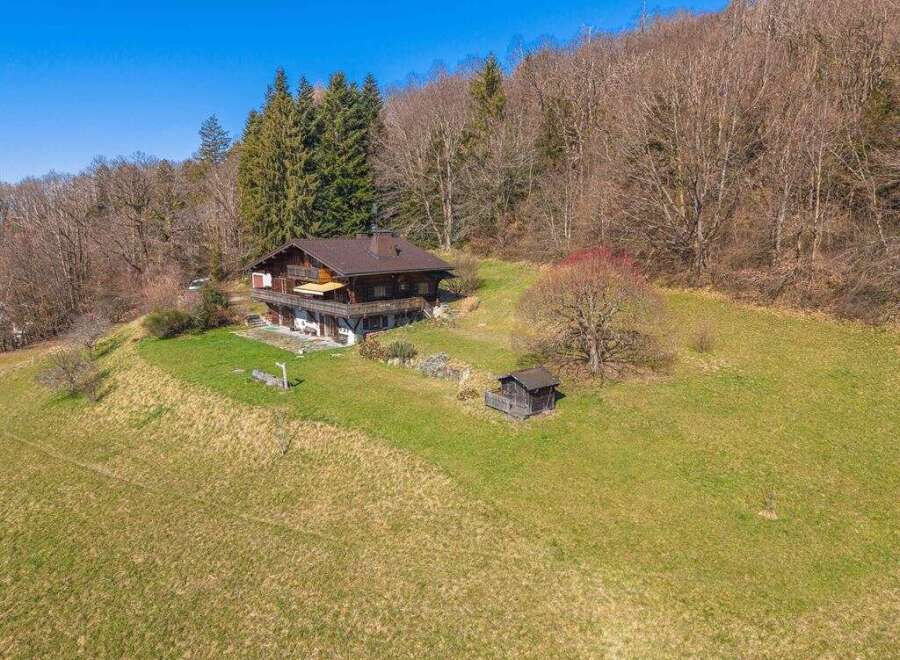 Nestled in a serene natural setting, this charming property offers a perfect blend of tranquility and comfort.