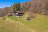 Nestled in a serene natural setting, this charming property offers a perfect blend of tranquility and comfort.