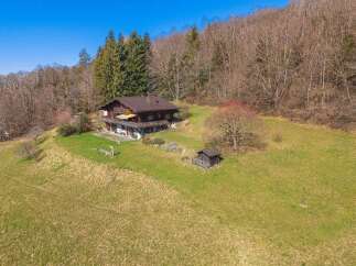Nestled in a serene natural setting, this charming property offers a perfect blend of tranquility and comfort.