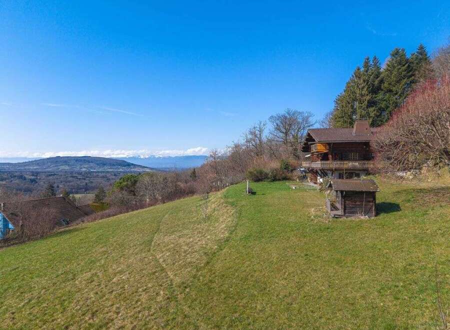 Nestled on a hillside, this charming property offers breathtaking views and a tranquil escape.