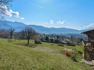 Enjoy breathtaking mountain views from this charming property.