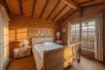 Step into a cozy bedroom retreat, where rustic charm meets modern comfort.