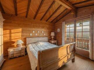 Step into a cozy bedroom retreat, where rustic charm meets modern comfort.