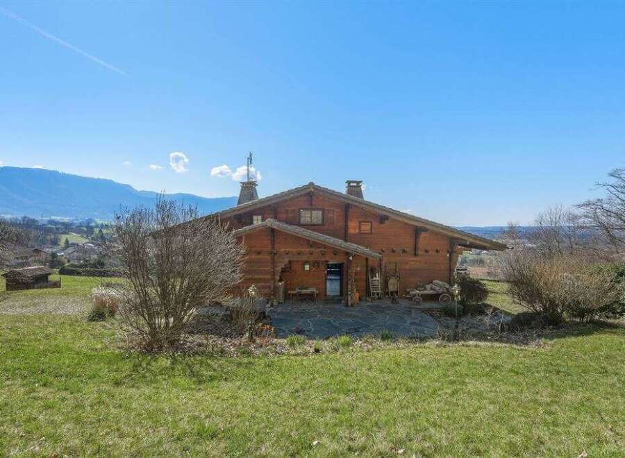 Nestled in a picturesque landscape, this charming wooden house offers a serene retreat.