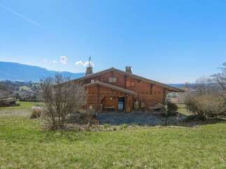 Nestled in a picturesque landscape, this charming wooden house offers a serene retreat.