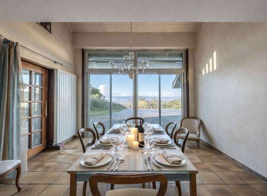Experience the charm of this elegant dining room, perfect for hosting memorable gatherings.